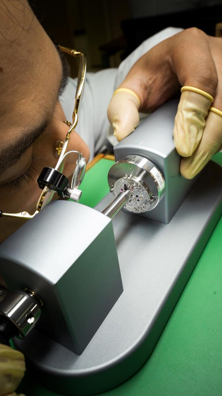 Luxury watch with a broken crystal.